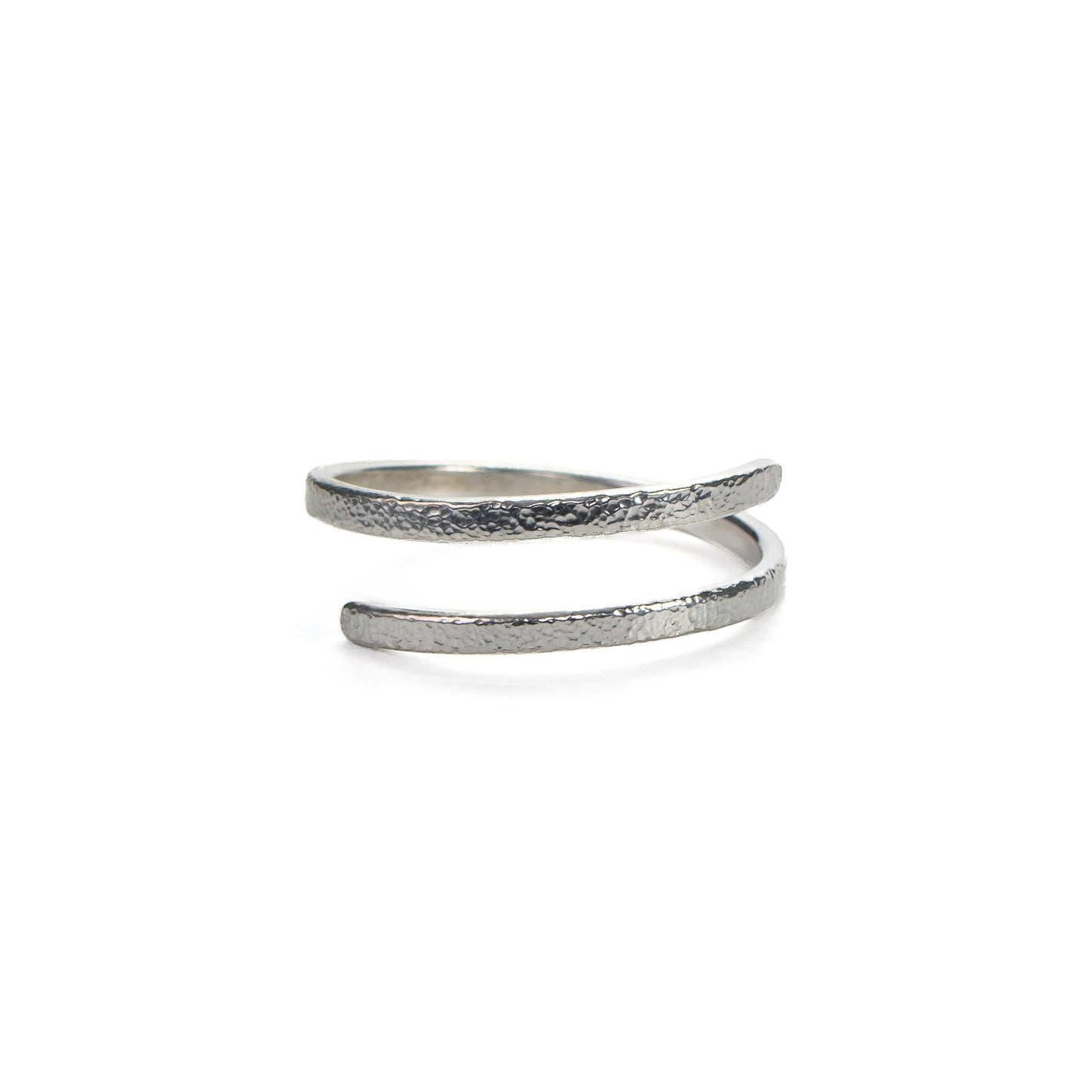 Adjustable hammered silver ring with fine textured finish on white background