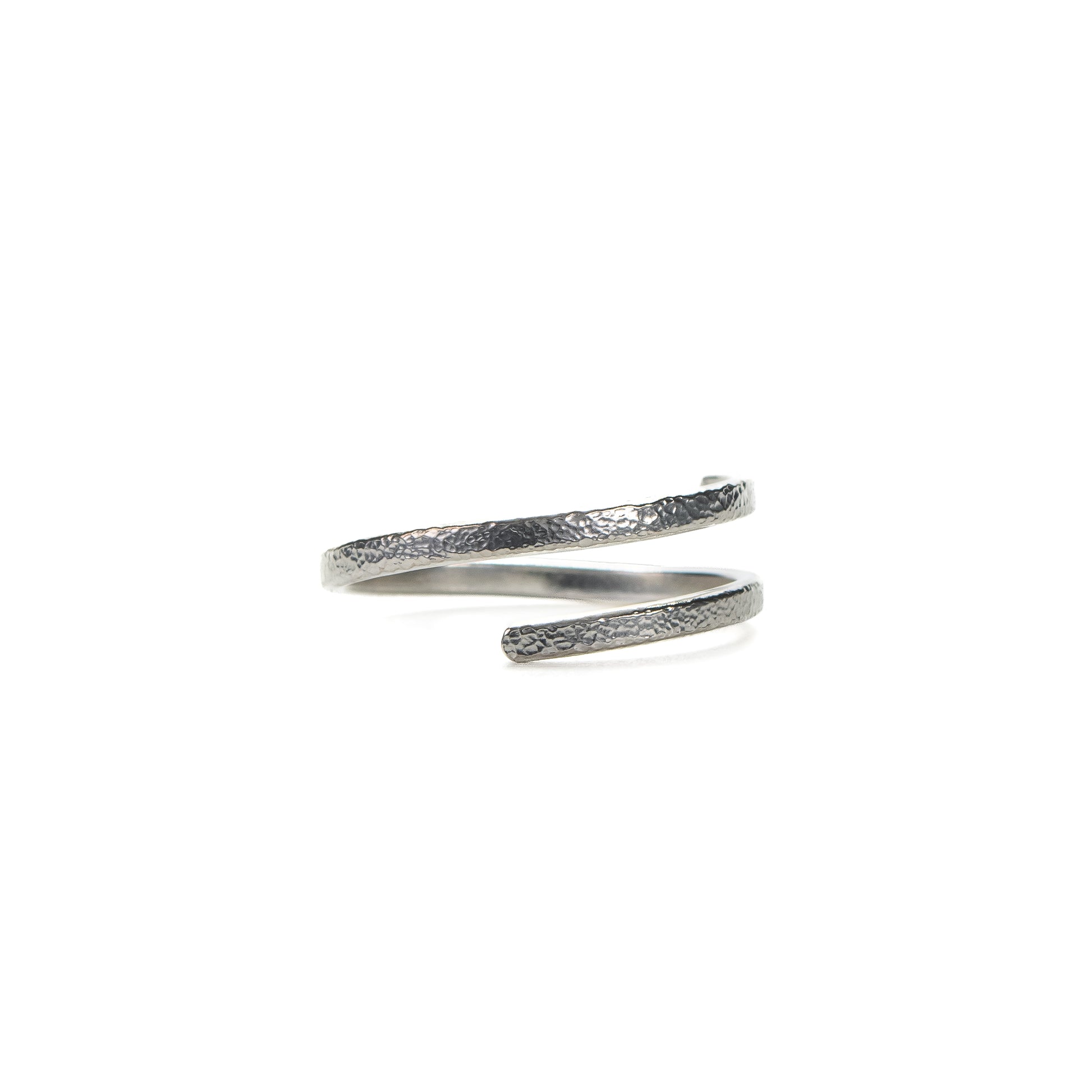 Silver spiral ring on a white background