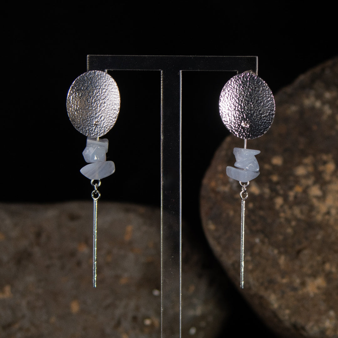Silver long stud earrings with blue lace agate chips and textured 50mm bar drop on stand