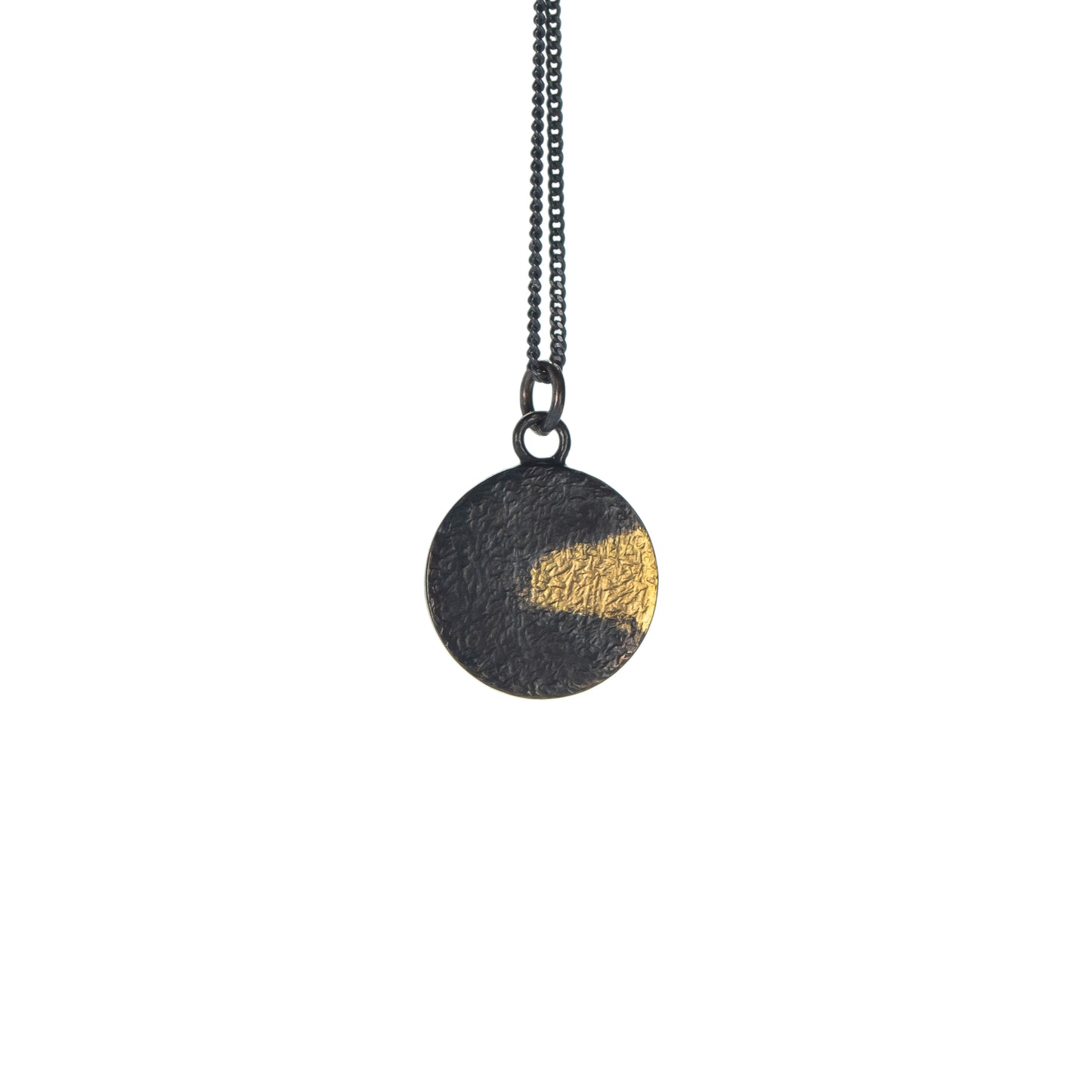 Oxidised silver disc necklace with rough hammer texture and gold detail