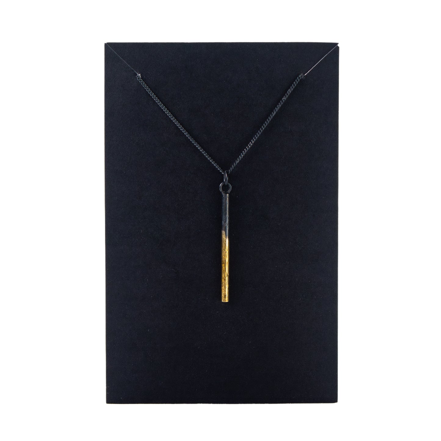 Oxidised silver pillar pendant necklace with gold detail on black display card