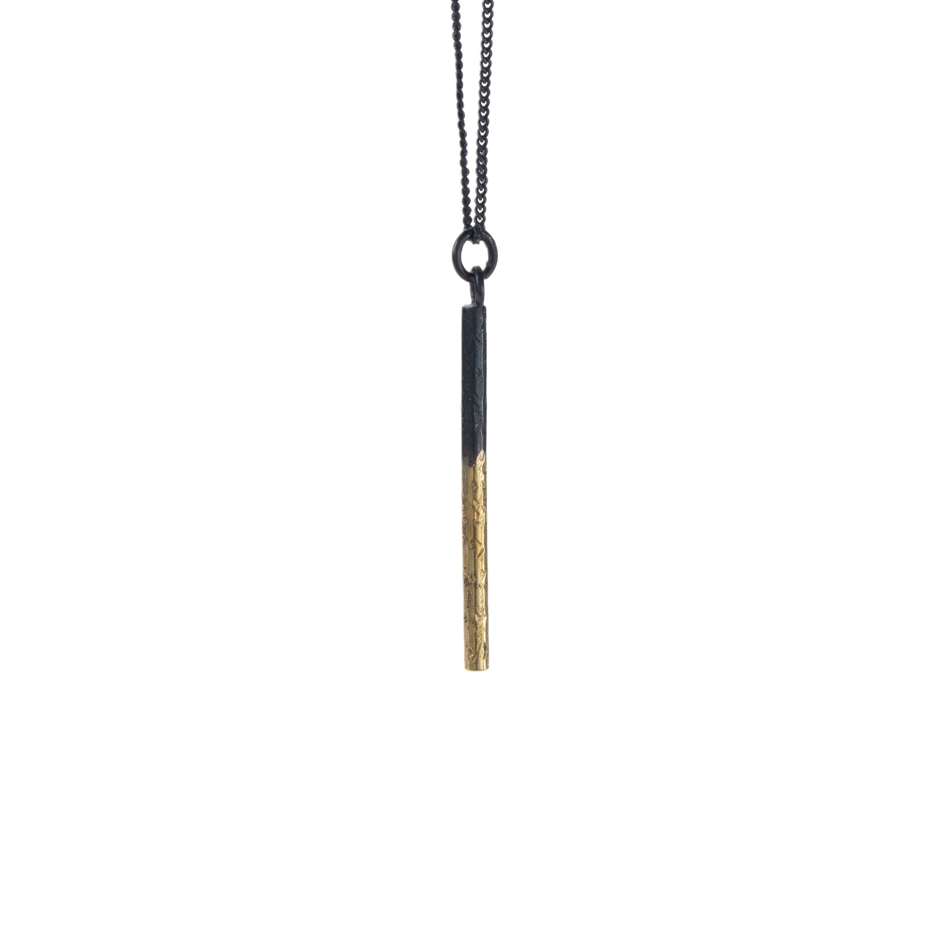 Oxidised silver pillar pendant necklace with rough hammered texture and gold detail