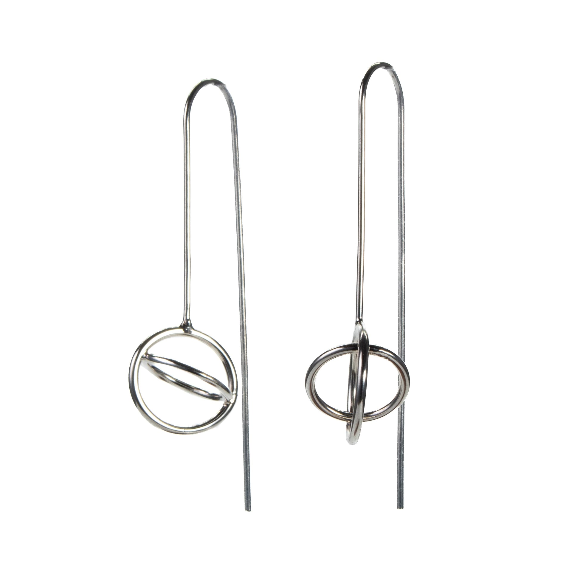 Sterling silver aperture dangle earrings photographed from the side