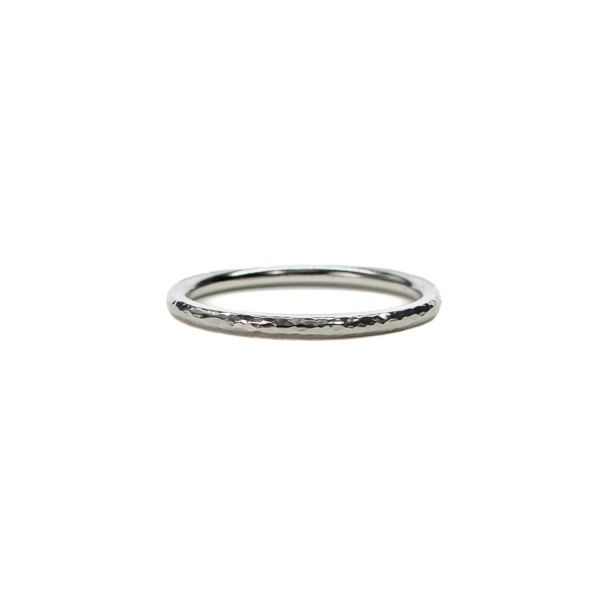 Ball Peen hammered textured silver stacking ring on white background